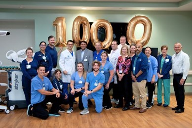 A group of people posing for a photo
Description automatically generated